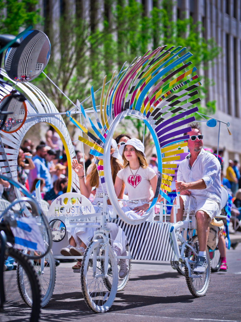 My neighbors riding the quadricycle at the Houston Art Car Parade